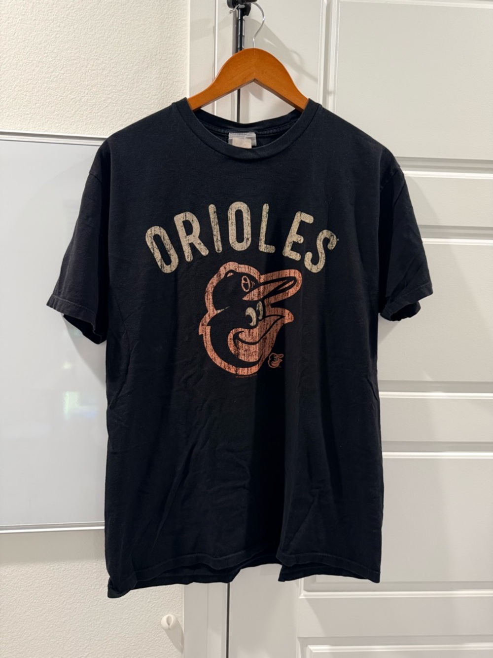 Genuine Merchandise Black Orioles Graphic Tee with Faded Orange Logo